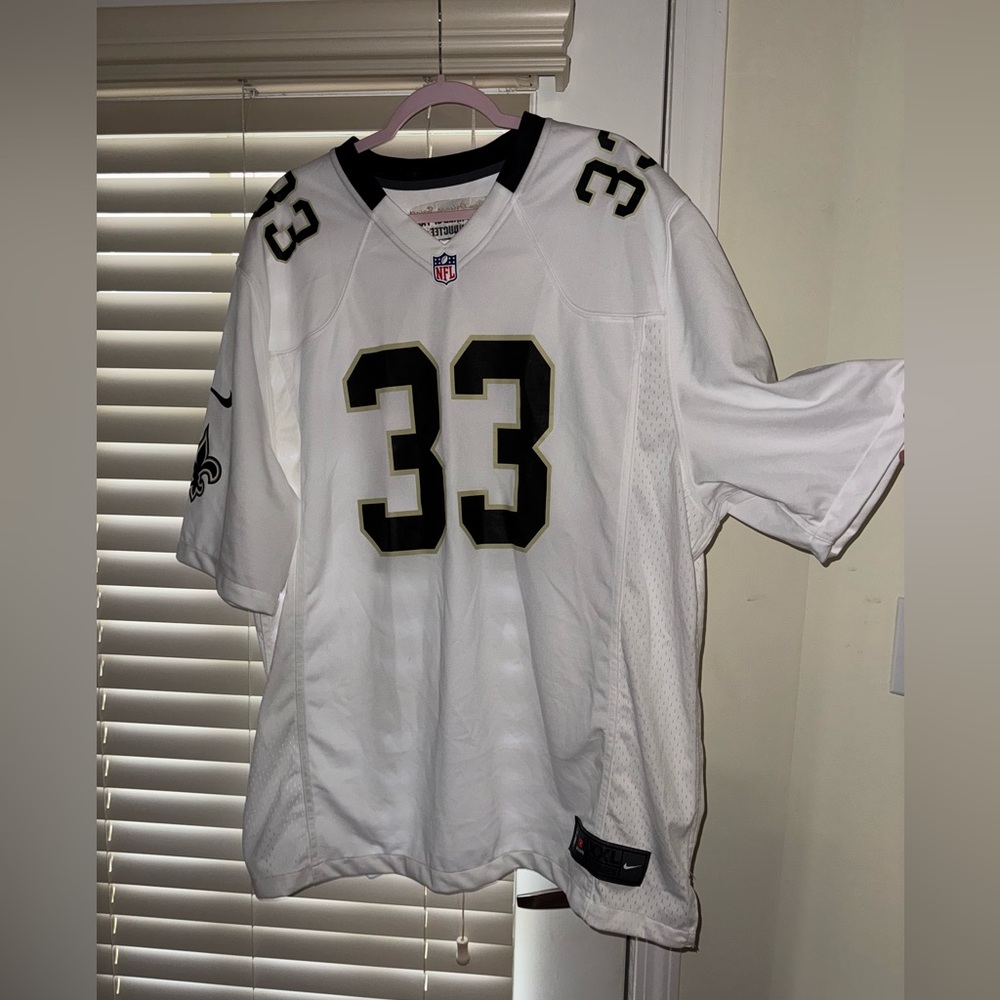 Signed Tyrone Hughes Saints jersey #33